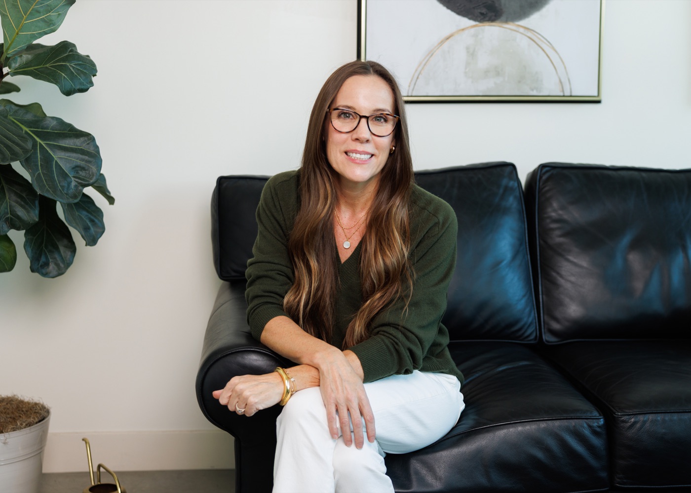 Dr. Jennifer Romesser, smiling in a green sweater